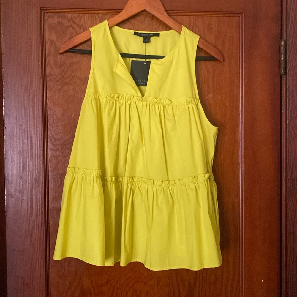 Mustard yellow, sleeveless ruffle blouse. New.